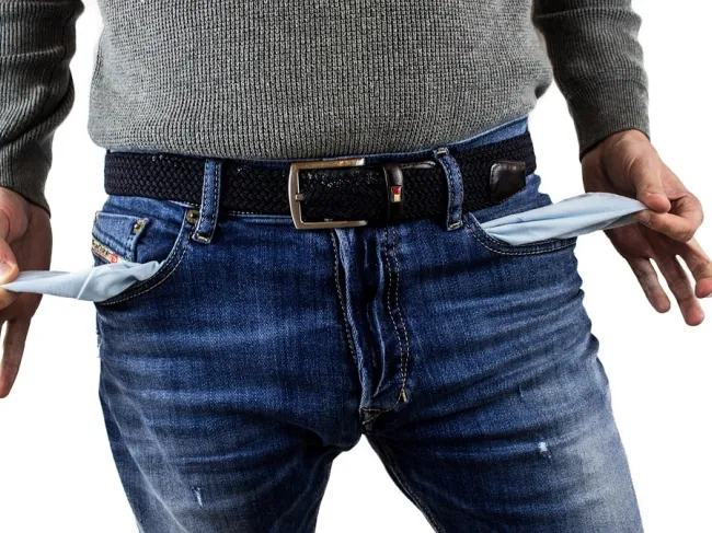 Man with empty pockets